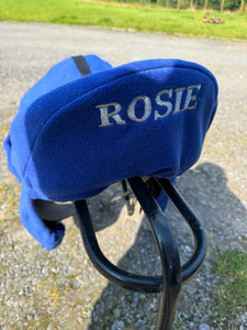 Embroidered storage saddle cover with girth tabs