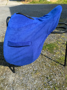 Embroidered storage saddle cover with girth tabs