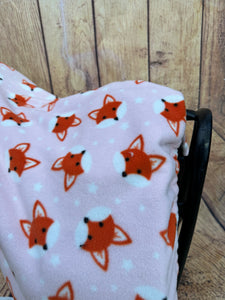 Baby pink fox fleece saddle cover.